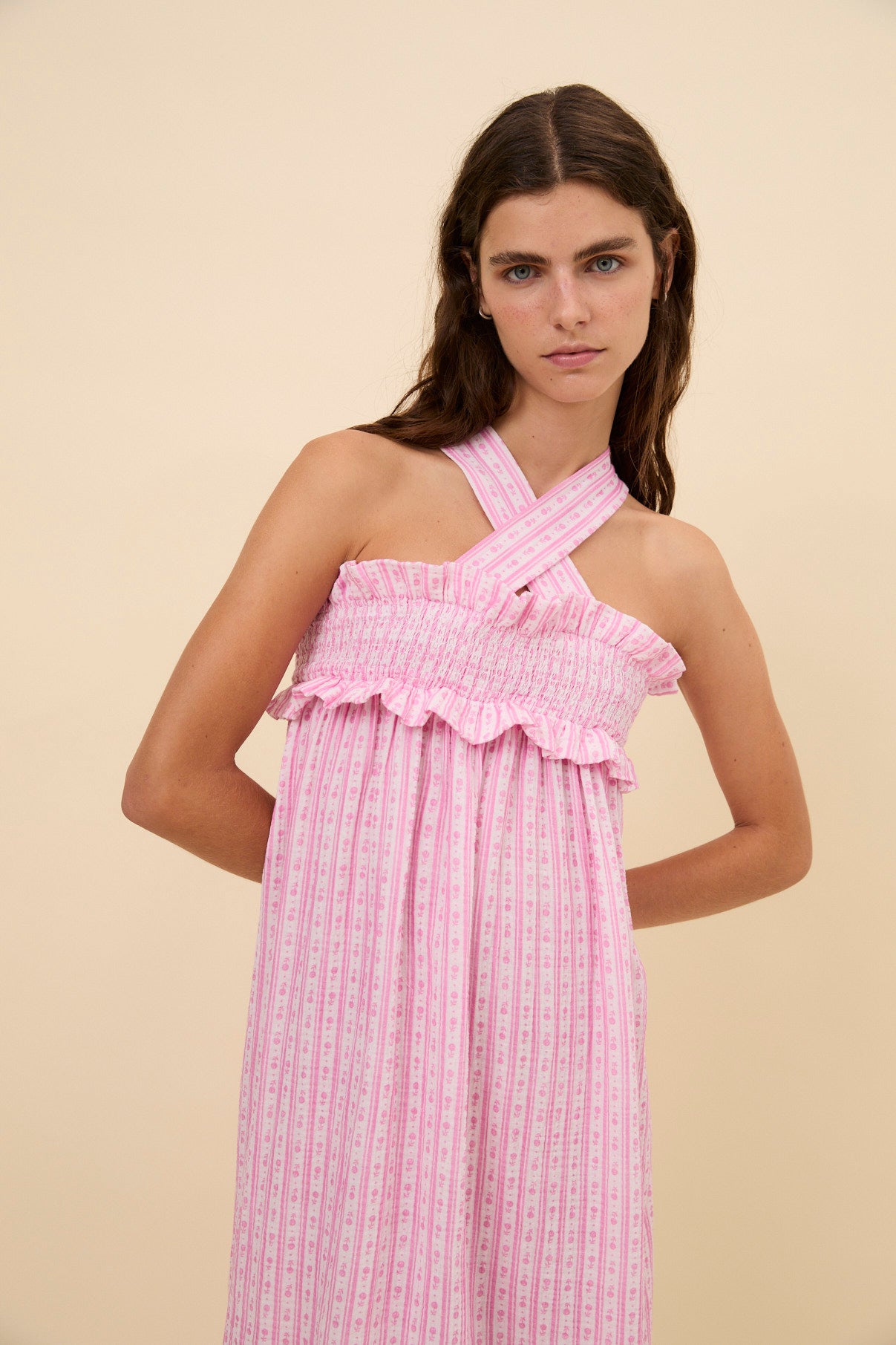 Woman Bares crossed dress