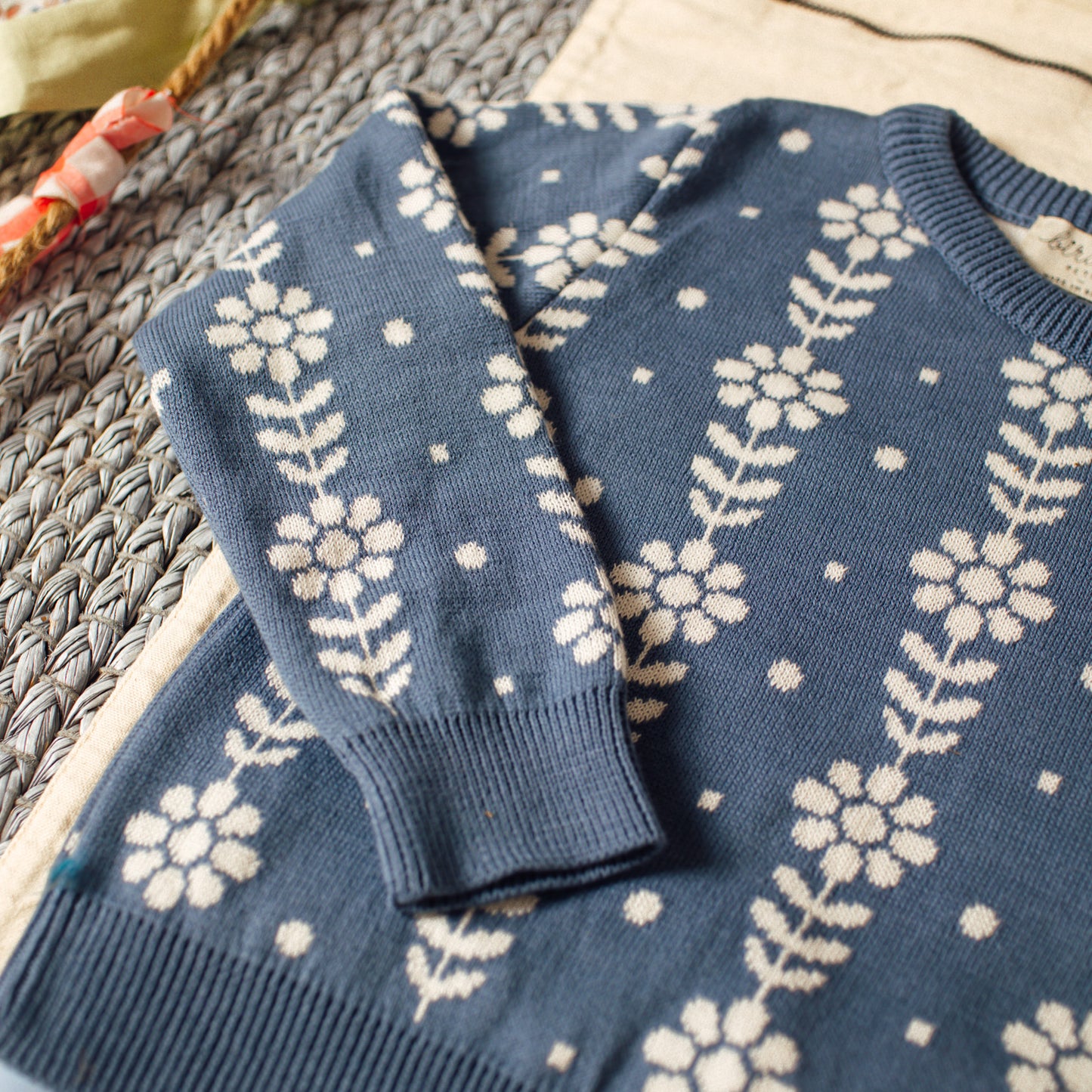 Grecas green and coral sweater