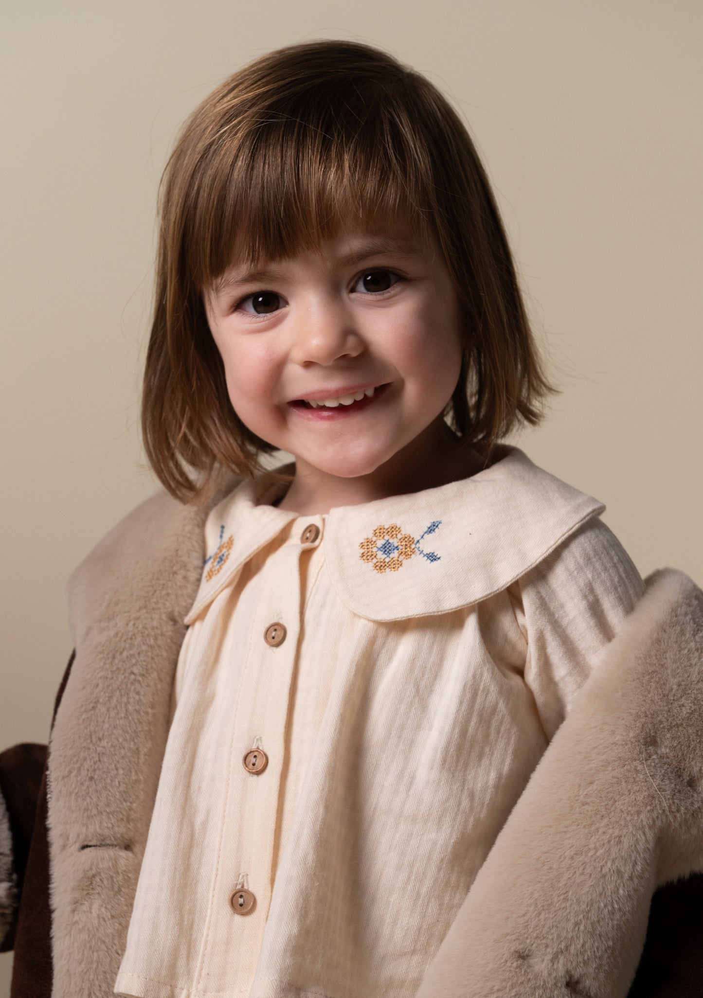 Ivory embroidered Peter Pan collar shirt