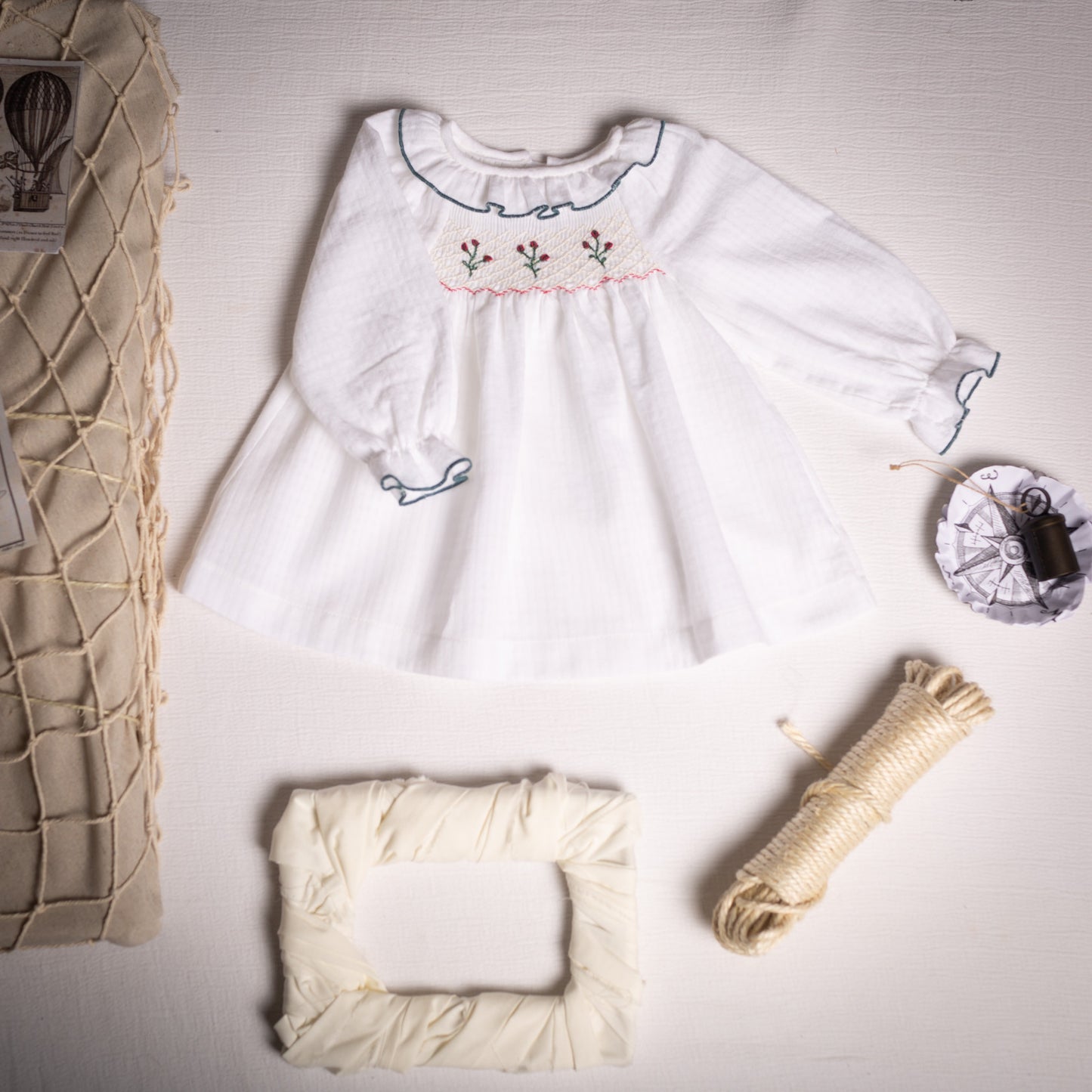 White embroidered smocked blouse