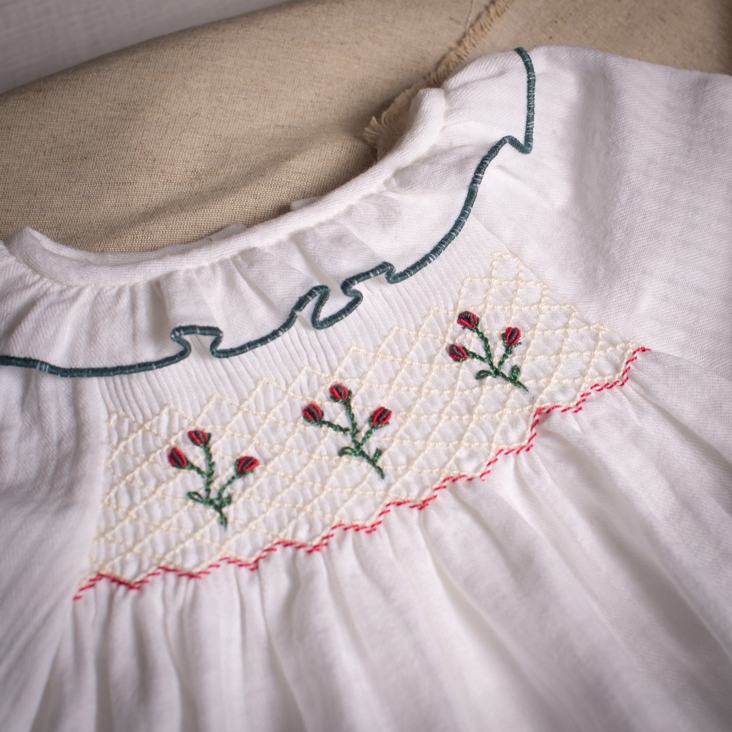 White embroidered smocked blouse