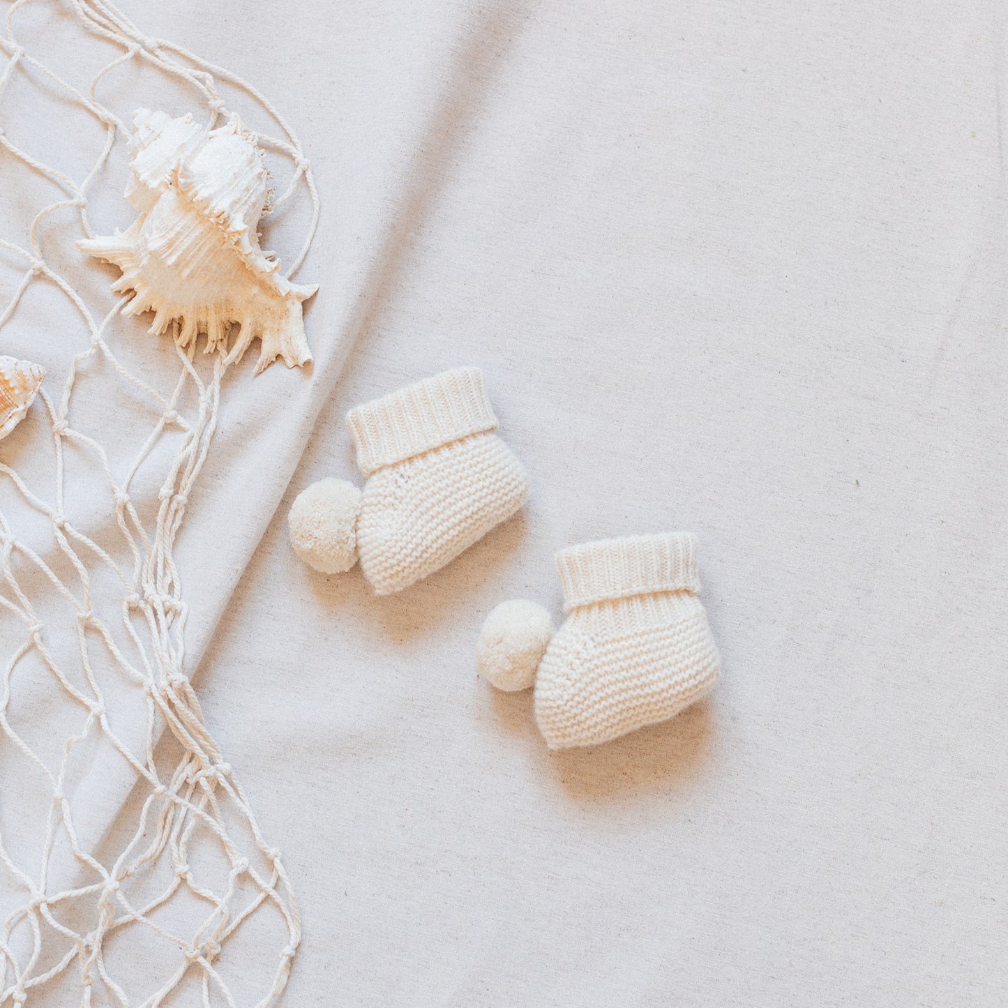 Ivory pompom booties