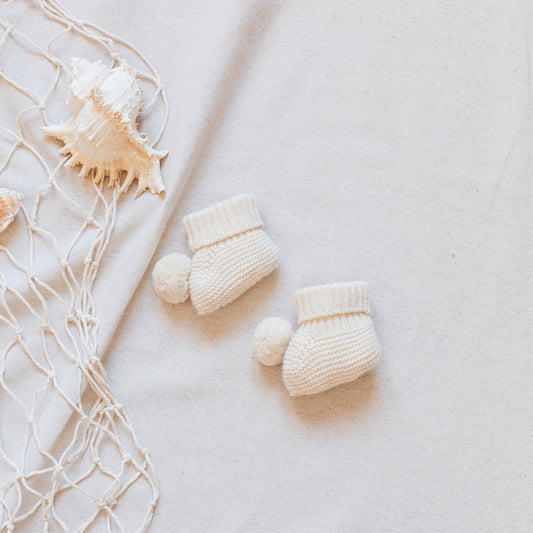 Ivory pompom booties