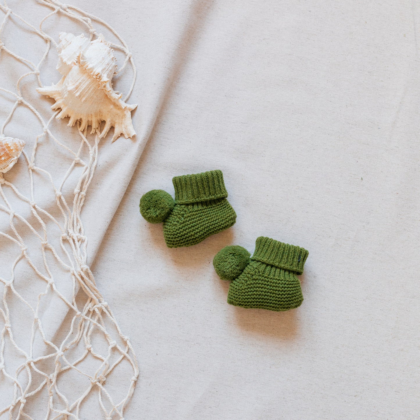 Green pompom booties