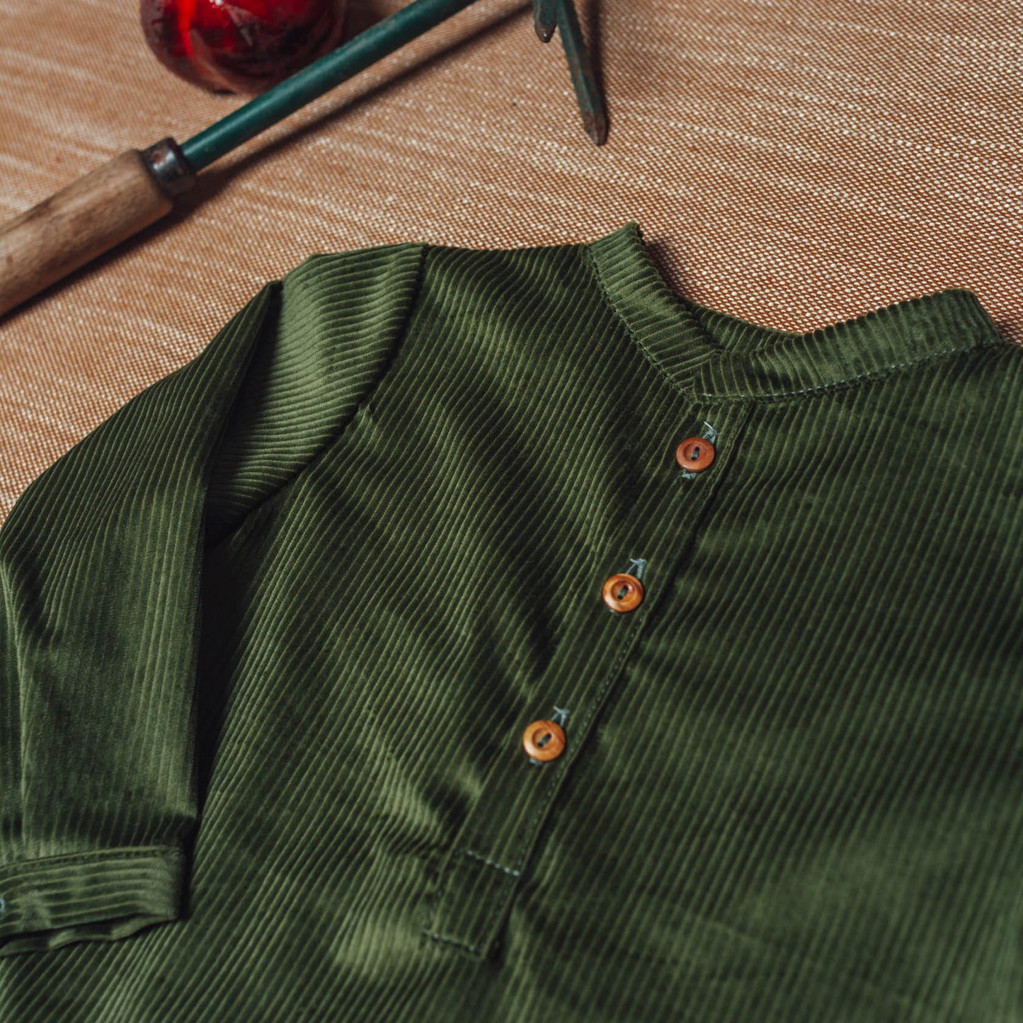 Green corduroy polo shirt