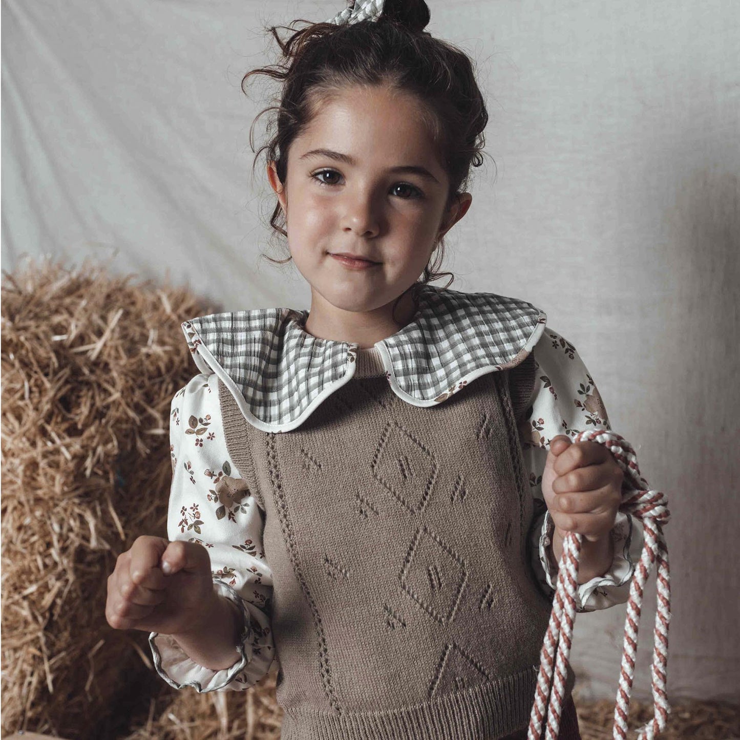 Greenish vest with ivory collar