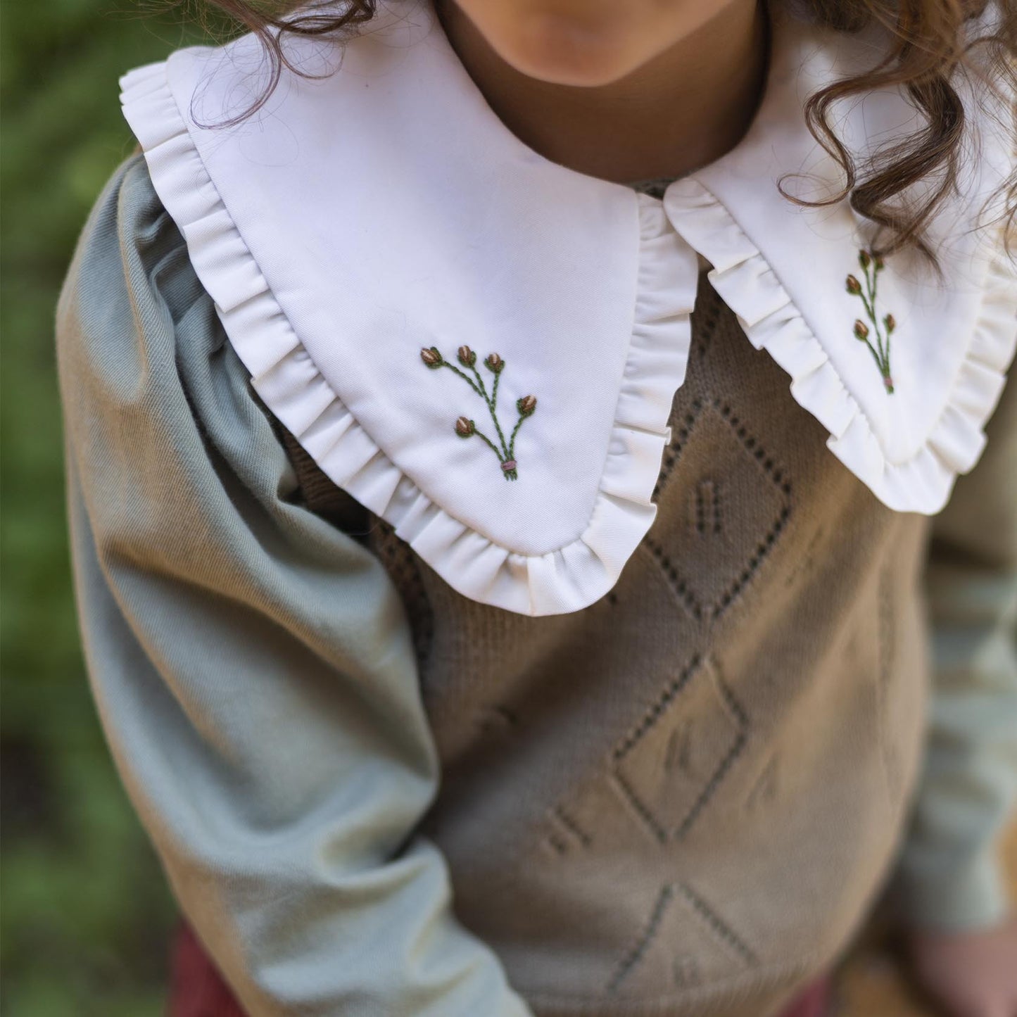 Greenish vest with ivory collar