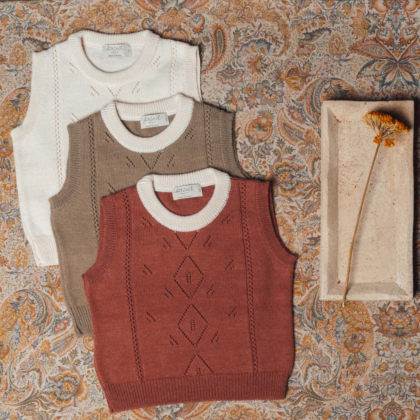 Terracotta vest with ivory collar