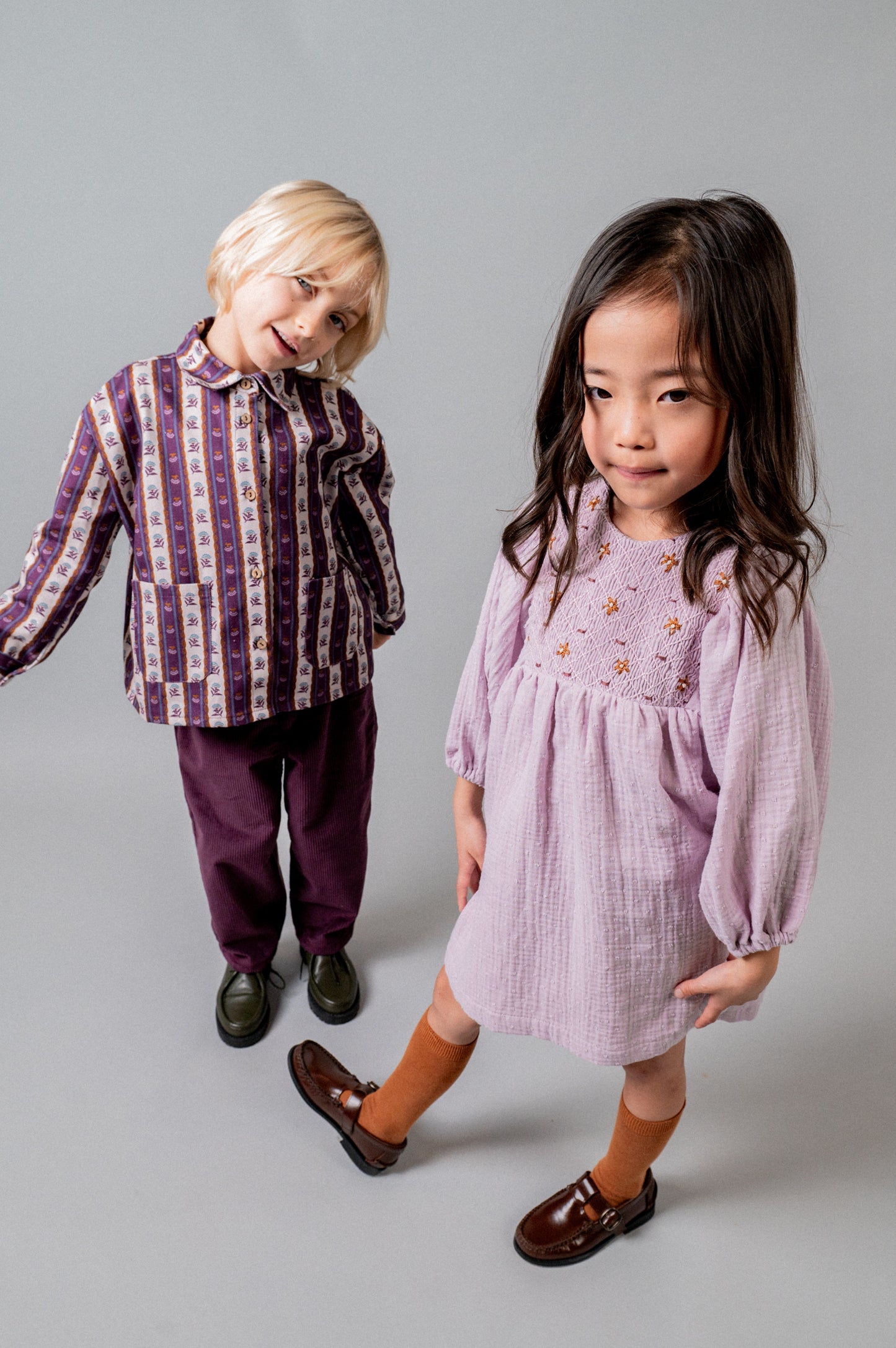 Vestido bordado nidos plumeti malva niña