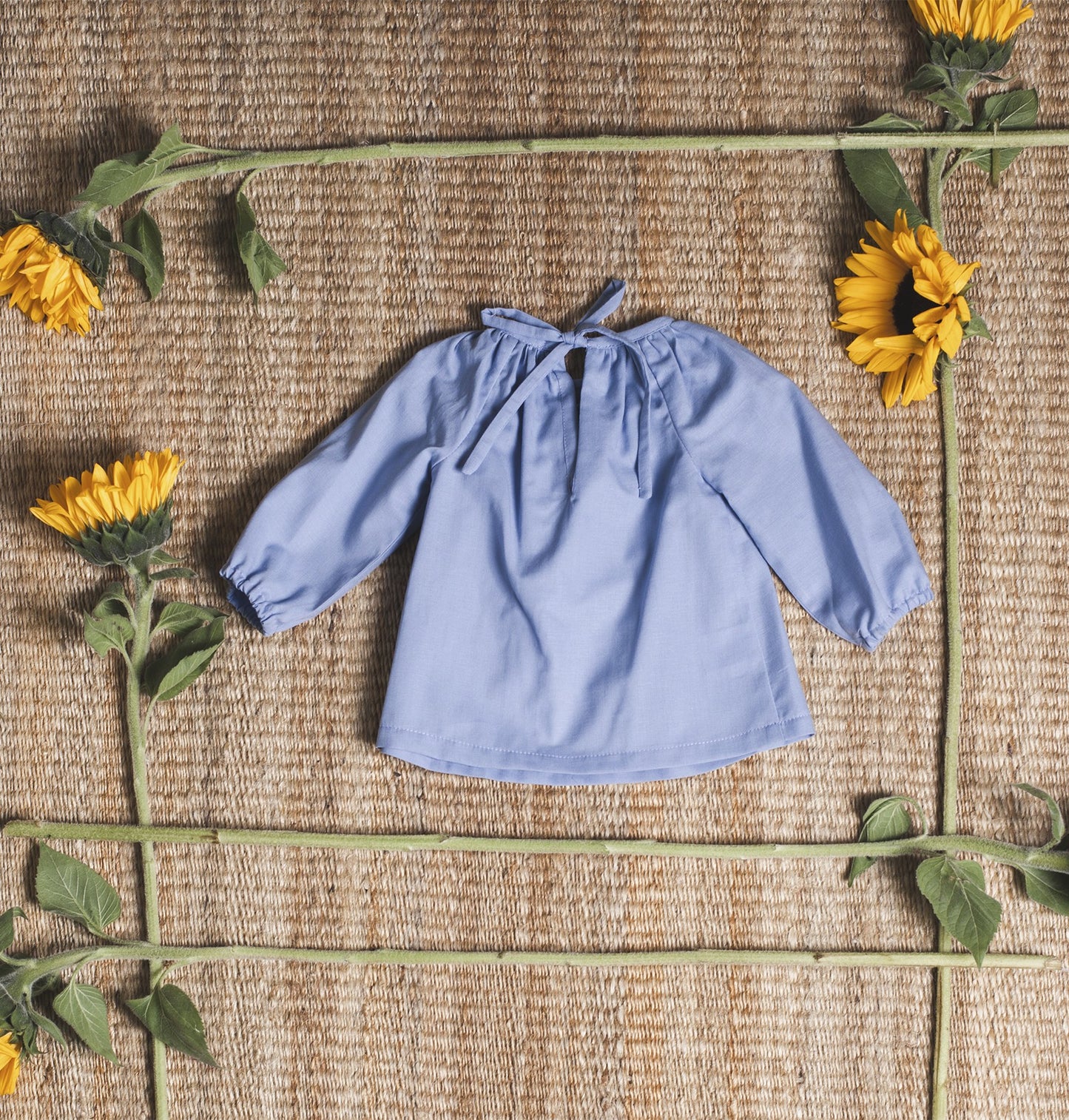 Bluish blouse with flower embroidered