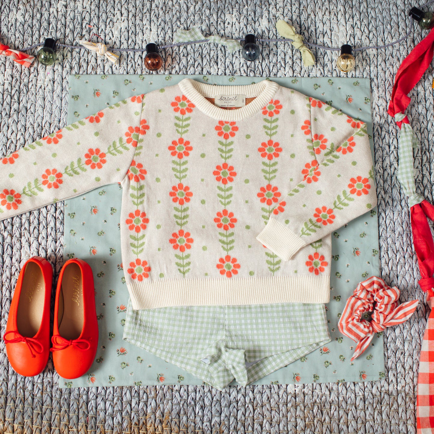 Grecas green and coral sweater