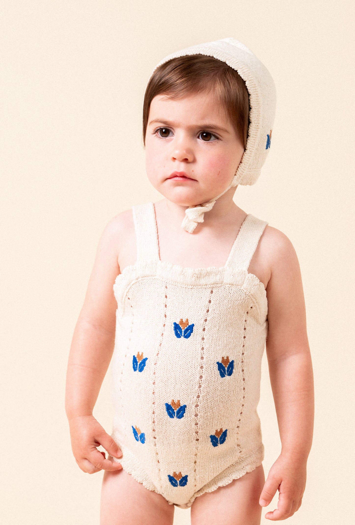 Knit bonnet with floral embroidery baby