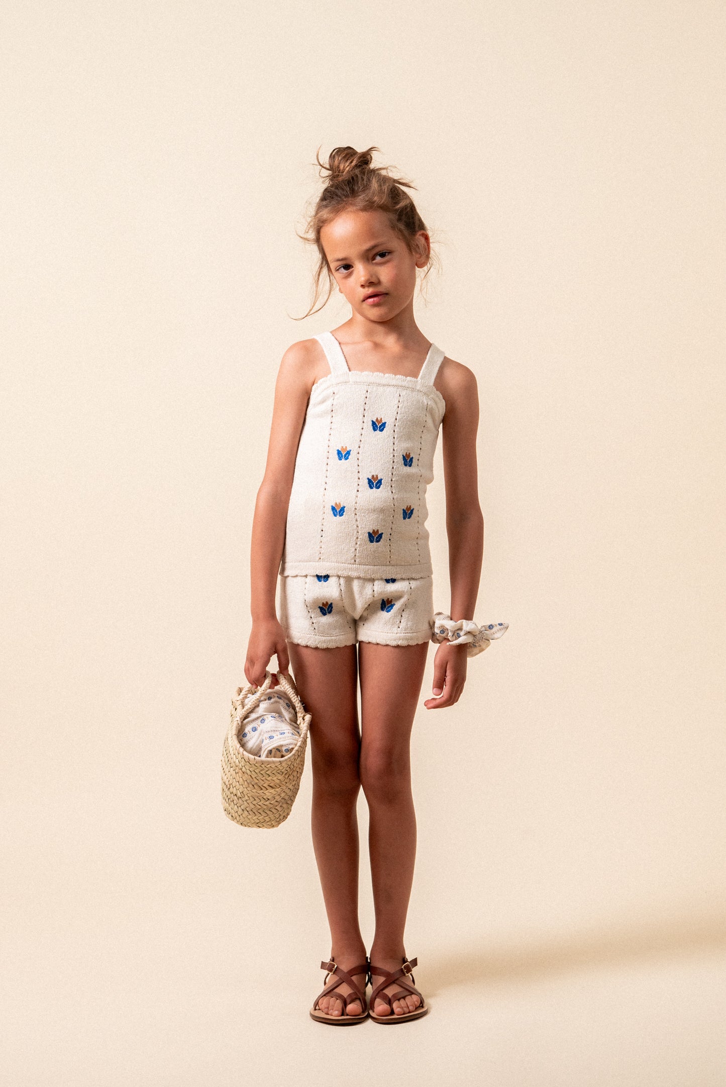 Knit top with floral embroidery girl